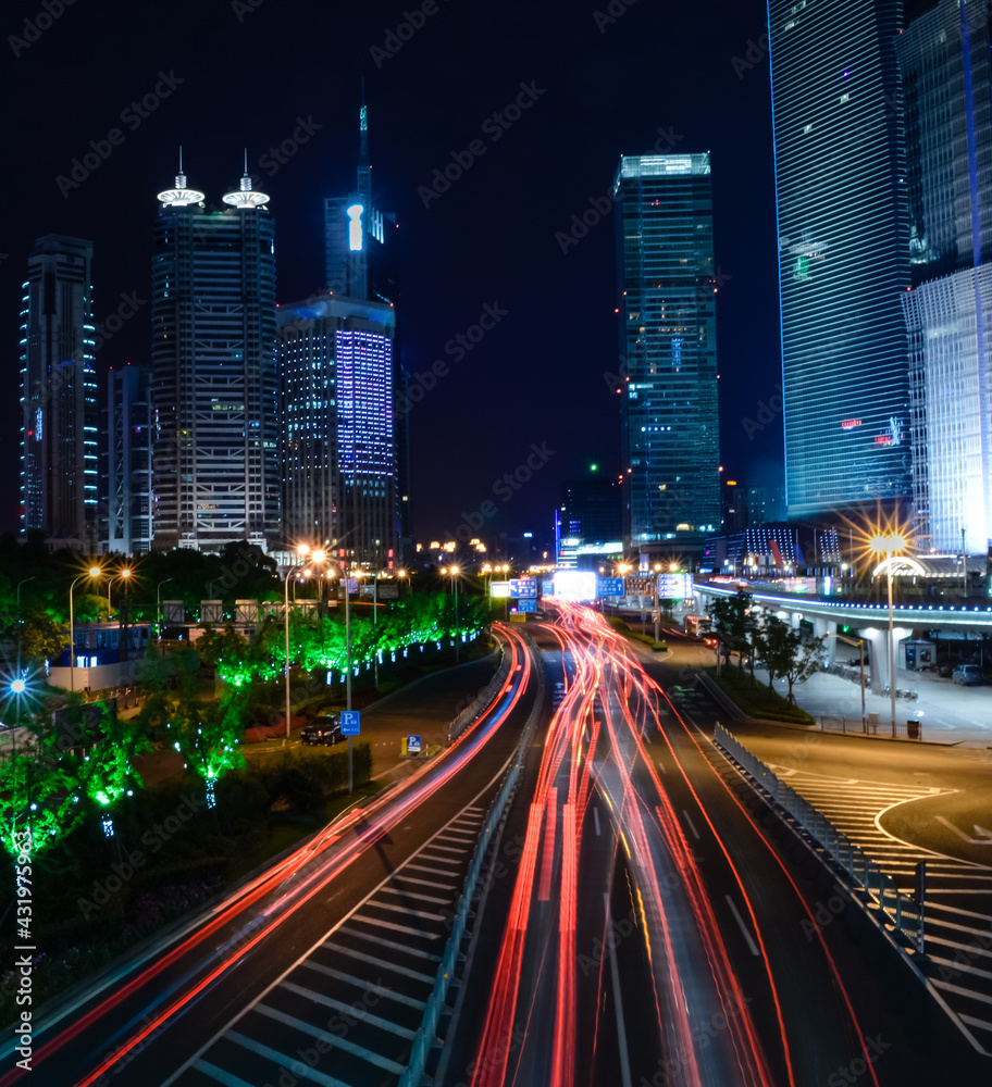 Fototapeta premium Red lights of car in motion, Shanghai downtown night