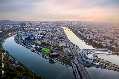 France, Auvergne-Rhone-Alpes, Lyon, Aerial view of city situated at confluence of Rhone and Saone rivers at dusk photo