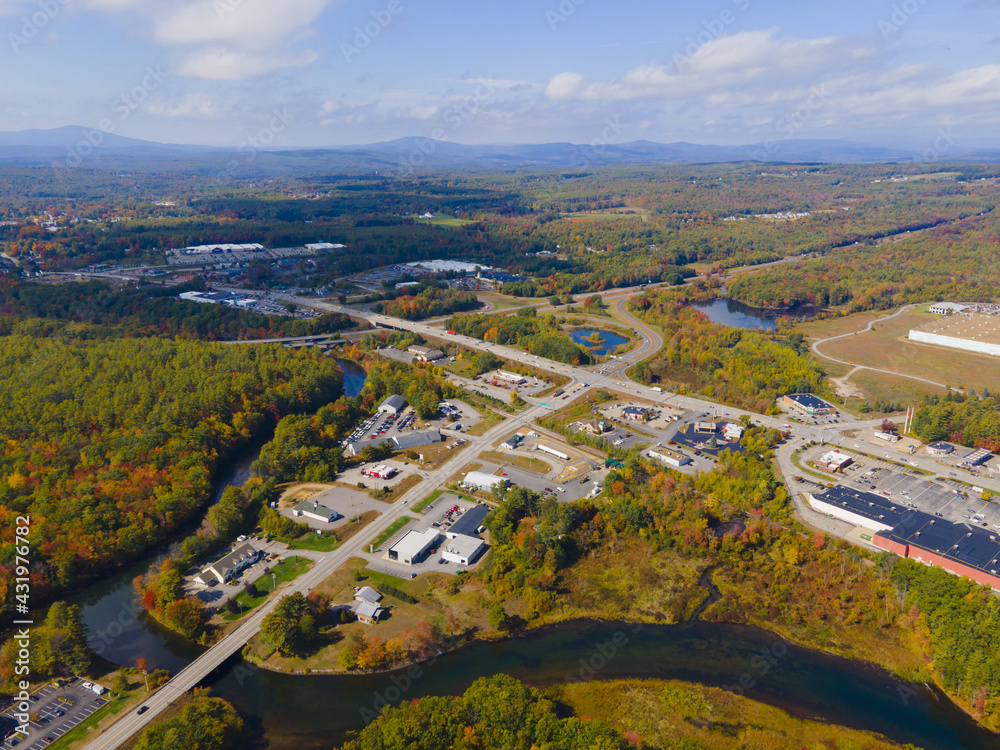 Interstate Highway 93 at Exit 20 with US Route 3 in White Mountain National Forest aerial view with fall foliage, Town of Tilton, New Hampshire NH, USA.