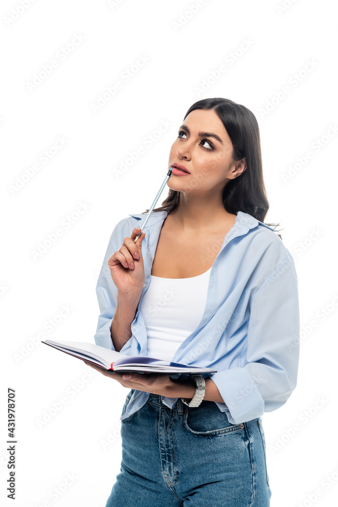 thoughtful businesswoman holding pen and notebook while looking away isolated on white. thoughtful businesswoman holding pen and notebook while looking away isolated on white.