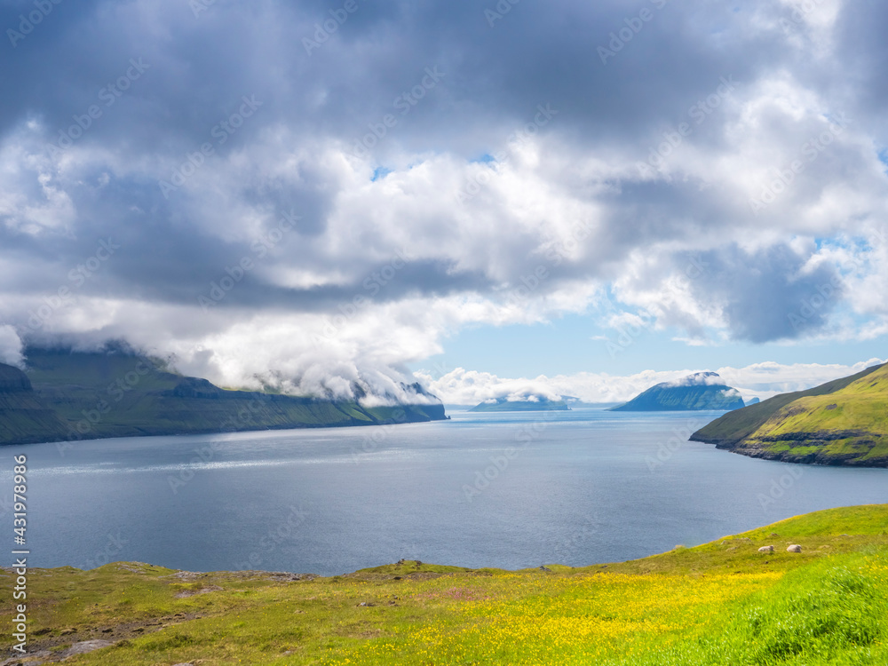 Tranquil view Vagar island by sea against cloudy sky, Iceland Tranquil view Vagar island by sea against cloudy sky, Iceland