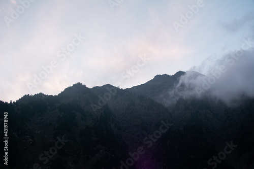 mountains and clouds with sunshine