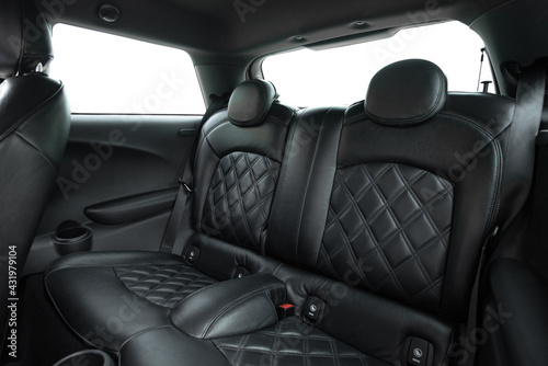 Rear passenger seat in a premium luxury car © Tarnun