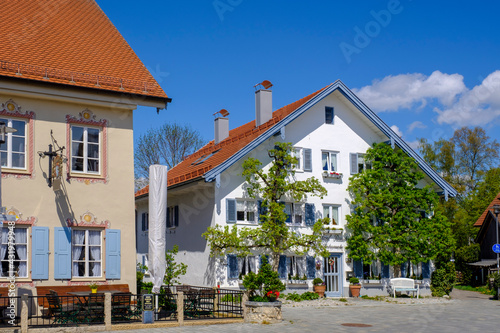 Germany, Bavaria, Diessen am Ammersee, Building facade covered with creeping plant photo