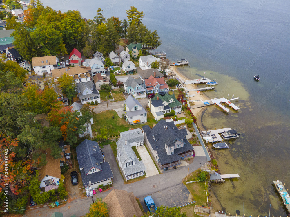 Lake Winnipesaukee and village of Weirs Beach aerial view with fall foliage in City of Laconia, New Hampshire NH, USA. 