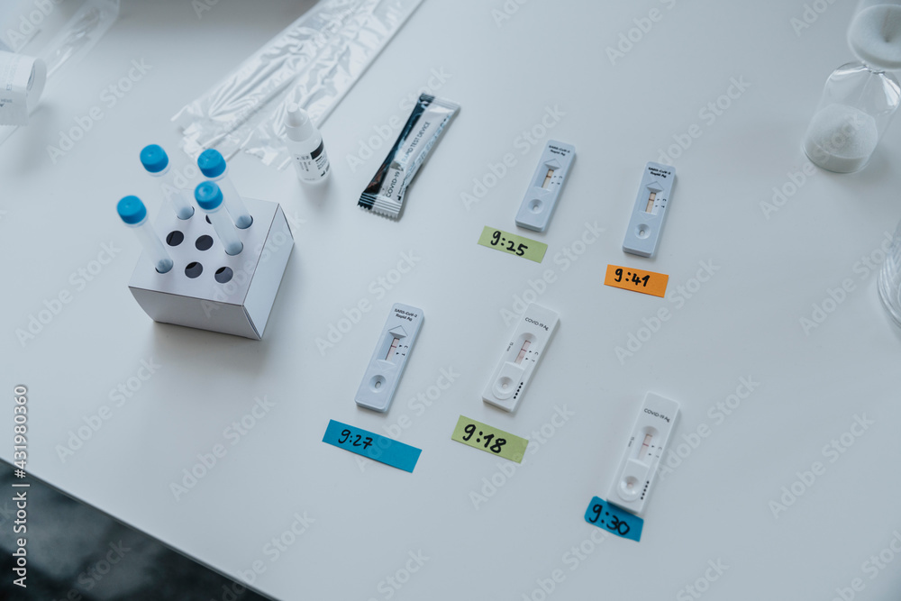 Variation of rapid diagnostic test cassettes with time sticker on table at clinic Variation of rapid diagnostic test cassettes with time sticker on table at clinic