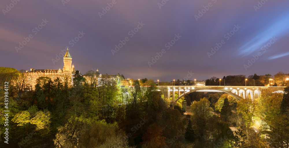 Adolphe Bridge by Musee de la Banque over Parcs de la Petrusse against sky, Luxembourg City, Luxembourg Adolphe Bridge by Musee de la Banque over Parcs de la Petrusse against sky, Luxembourg City, Luxembourg