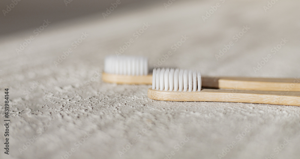 Bamboo brushes on a white background copy space. Concern for the environment. Toothbrush. Dental health. Copy space . Bamboo brushes on a white background copy space. Concern for the environment. Toothbrush. Dental health. Copy space .