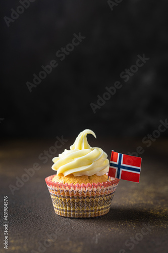 A photo of muffins with Norwegian flag to Norwegian Independence day or for birthday