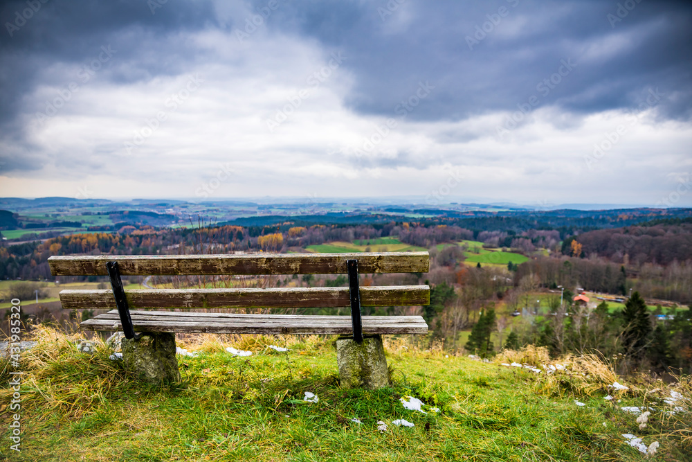 Bench on landscape against cloudy sky, Upper Platinate, Germany Bench on landscape against cloudy sky, Upper Platinate, Germany