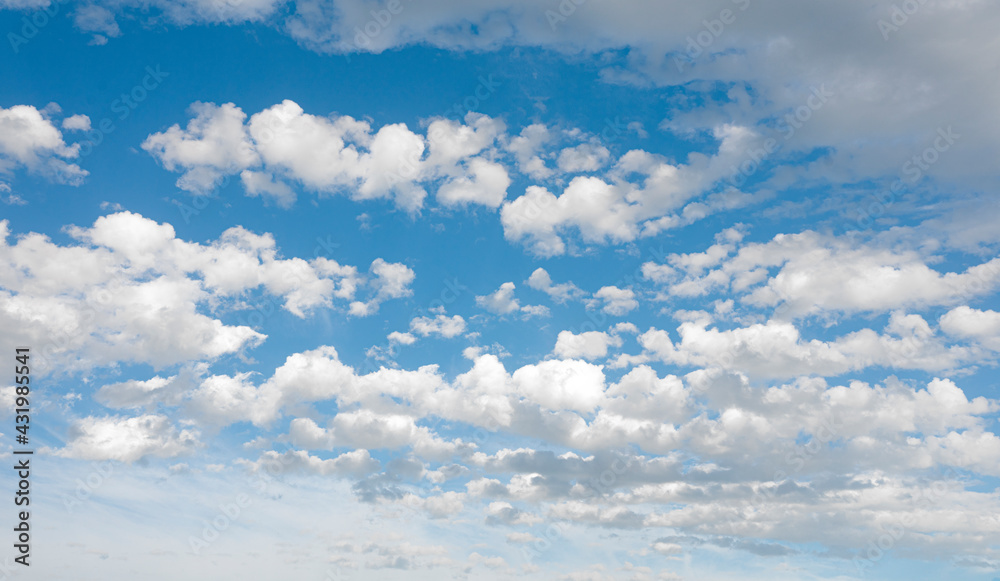 Abstract clouds sky background with white volumetric foamy clouds in the blue sky, dark rain clouds. Many cumulus clouds. Banner. Background. copy space for text Abstract clouds sky background with white volumetric foamy clouds in the blue sky, dark rain clouds. Many cumulus clouds. Banner. Background. copy space for text