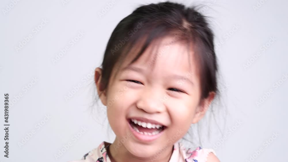 Portrait of happy Asian cute little child girl smile and laughing on white background. Portrait of happy Asian cute little child girl smile and laughing on white background.