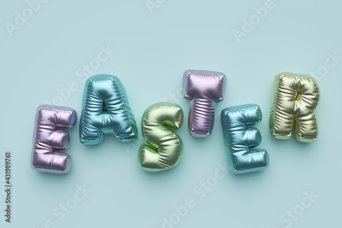 Three dimensional render of pastel colored balloons arranged into single word