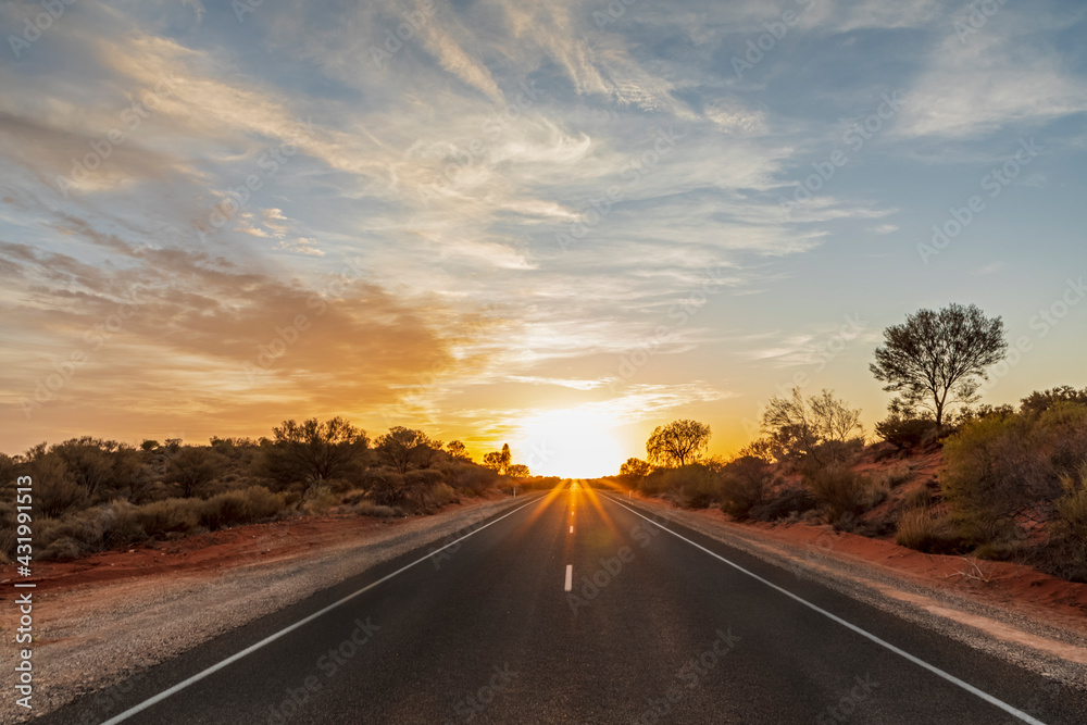 Empty Lasseter Highway at sunrise , Australia Empty Lasseter Highway at sunrise , Australia
