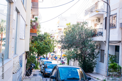 Fototapeta Naklejka Na Ścianę i Meble -  beautiful streets of Athens with blocks of flats, cars and shops