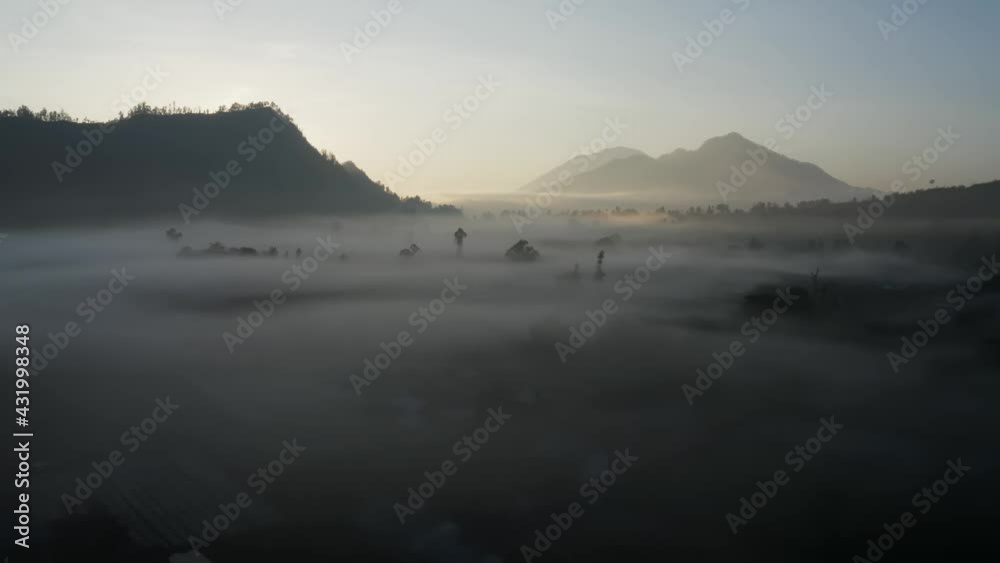 Drone Shot Flying Over Low Hanging Mist Around Mount Batur Volcano Drone Shot Flying Over Low Hanging Mist Around Mount Batur Volcano