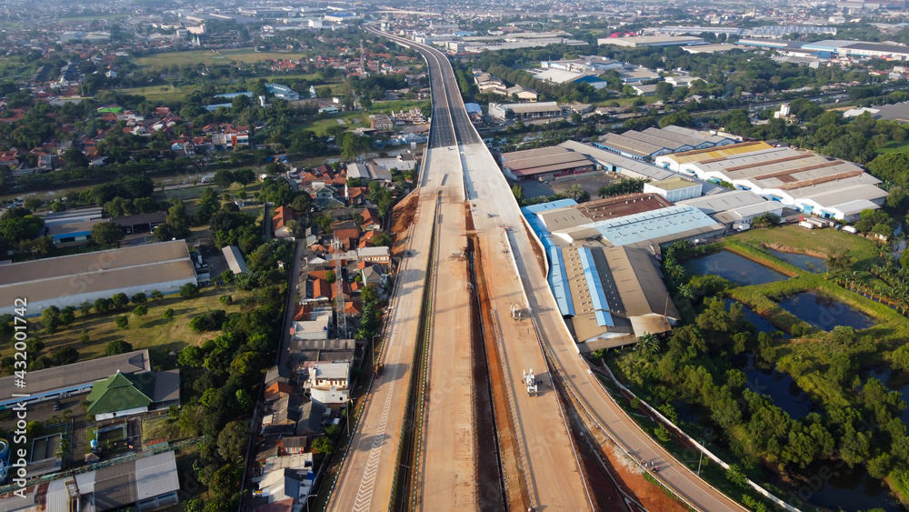 Fototapeta Aerial view on the new road construction site at Bekasi. Bekasi, Indonesia, April 26, 2021