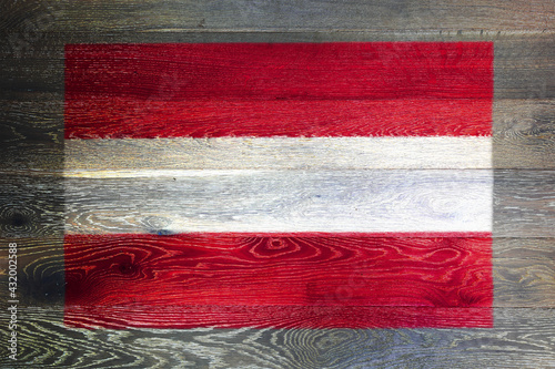 Austria flag on rustic old wood surface background
