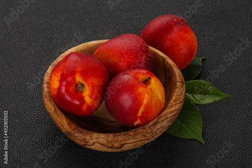 Sweet tasty ripe few nectarines photo