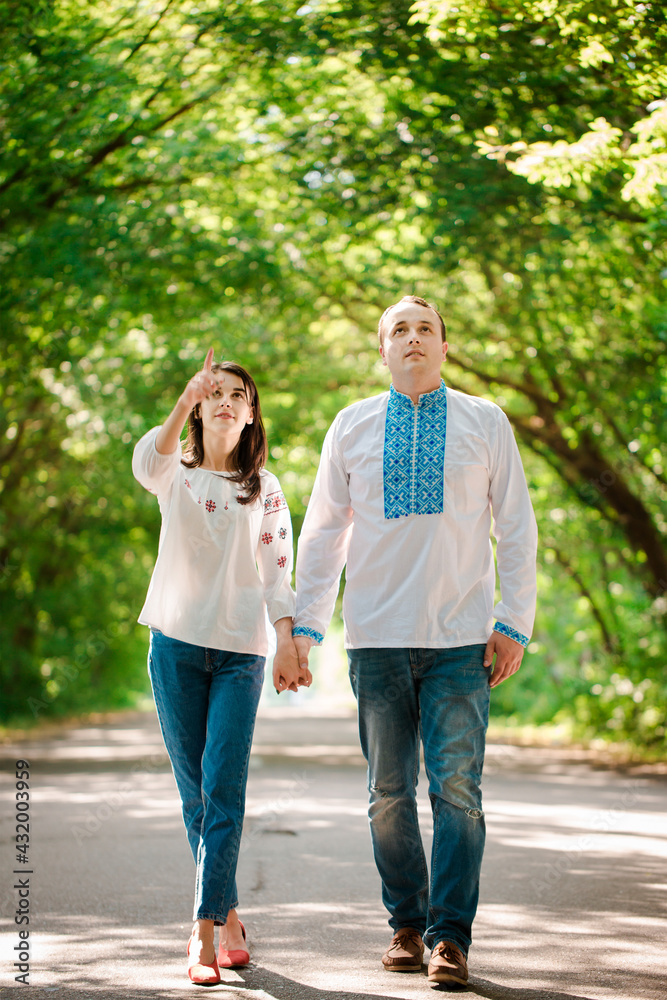 Couple walking along the road holding hands Couple walking along the road holding hands