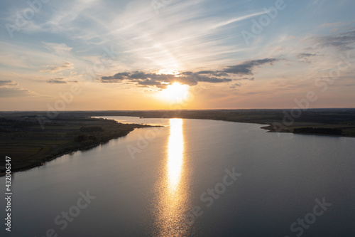 Aerial view of a still lake at sunset