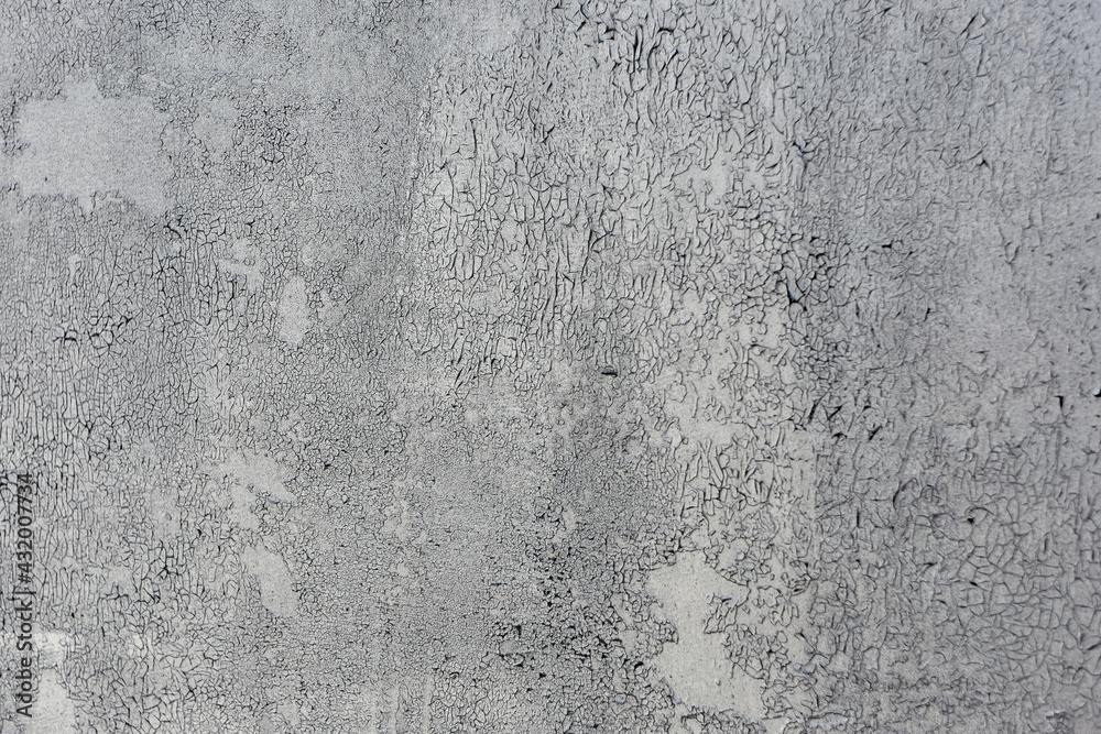 Texture of a wall made of rough metal painted with gray cracked paint Texture of a wall made of rough metal painted with gray cracked paint