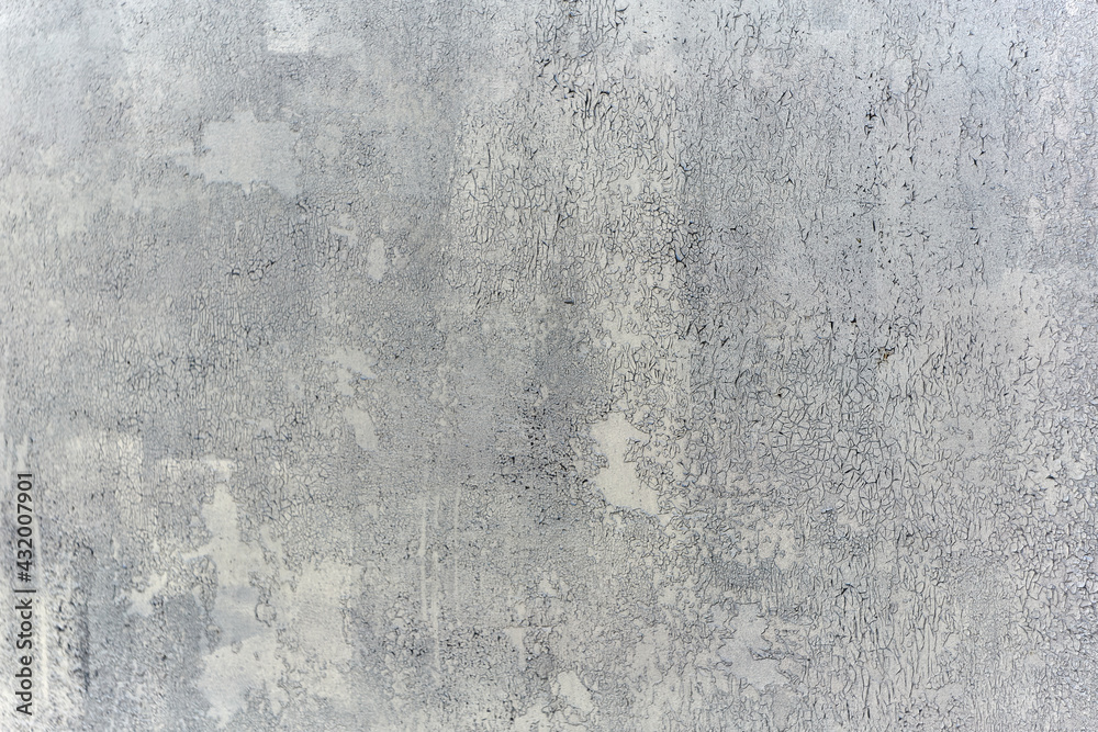 Fototapeta premium Texture of a wall made of rough metal painted with gray cracked paint