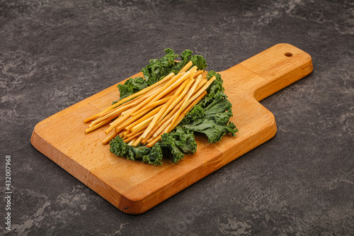 Chechel cheese sticks over board photo