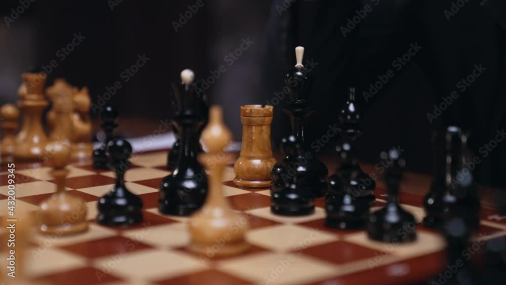 Two chess players man and woman play chess. Debut Accepted Queen's Gambit, King's Gambit, Philidor's Defense. Cinematic filming of a chess game. Antique chess board. This shot can be used for films