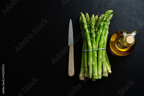 Green asparagus on dark background