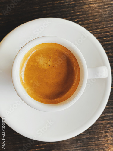 Fresh italian espresso in cup on table