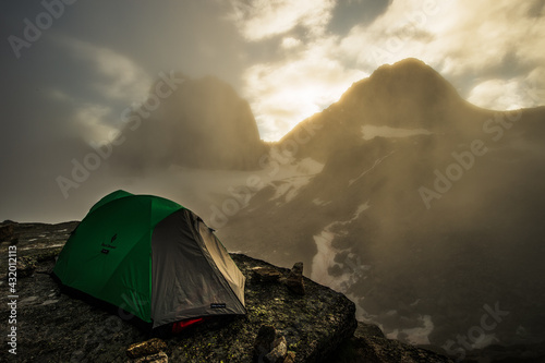 Tent below Snow Patch and Bugaboo Spires in Bugaboo Providential Park, British Columbia, Canada photo