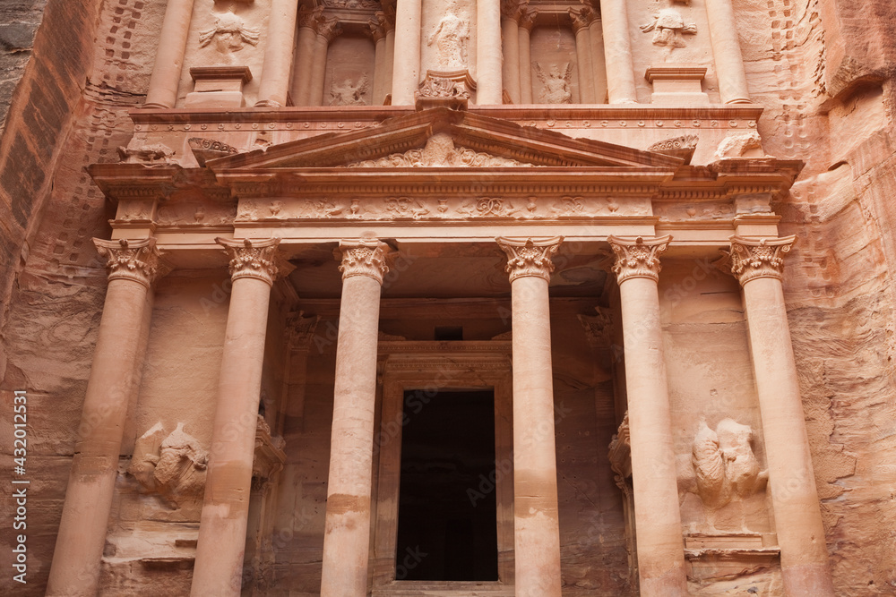 The intricately carved facade of The Treasury (Al Khazneh) in Petra, Jordan. The intricately carved facade of The Treasury (Al Khazneh) in Petra, Jordan.
