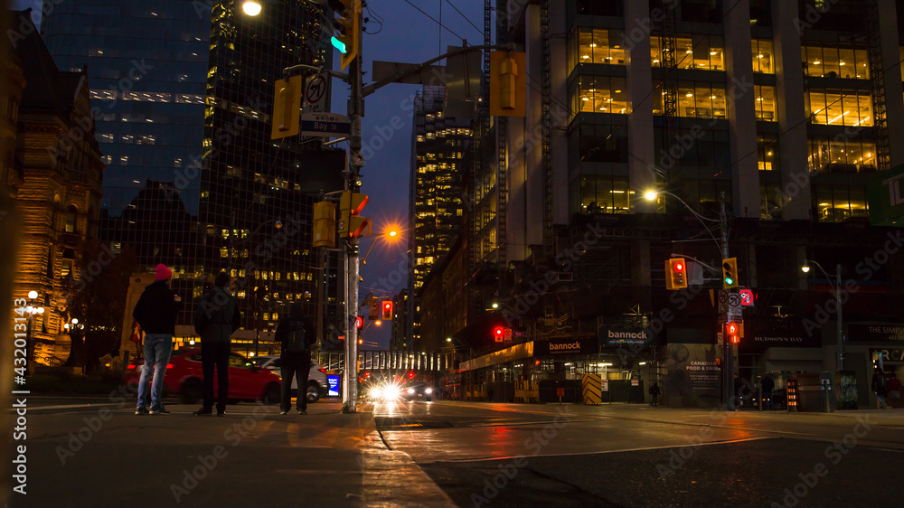 night traffic in the city Toronto downtown. Pedestrians, cars and street lights