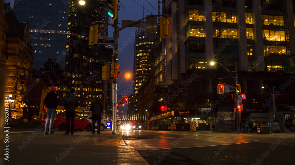 night traffic in the city Toronto downtown. Pedestrians, cars and street lights night traffic in the city Toronto downtown. Pedestrians, cars and street lights