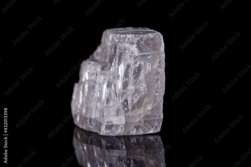 Macro mineral stone Iceland spar on black background Macro mineral stone Iceland spar on black background