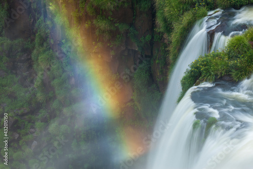Detail of a waterfall and rainbow in Argentina's Iguazu Falls.