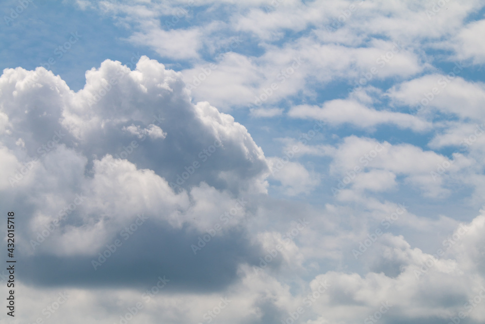 beautiful puffy cumulus clouds slight stormy weather with blue sky beyond nature background beautiful puffy cumulus clouds slight stormy weather with blue sky beyond nature background