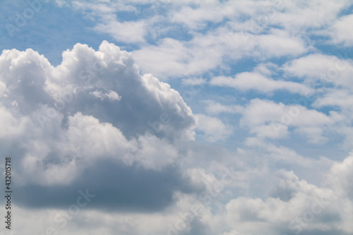beautiful puffy cumulus clouds slight stormy weather with blue sky beyond nature background