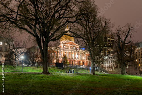 The Massachusetts State House as viewed at night from the Boston Commons in Boston, MA. photo