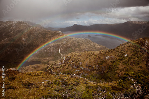 Double rainbows span the side of a mountain in Chilean Southern Patagonia