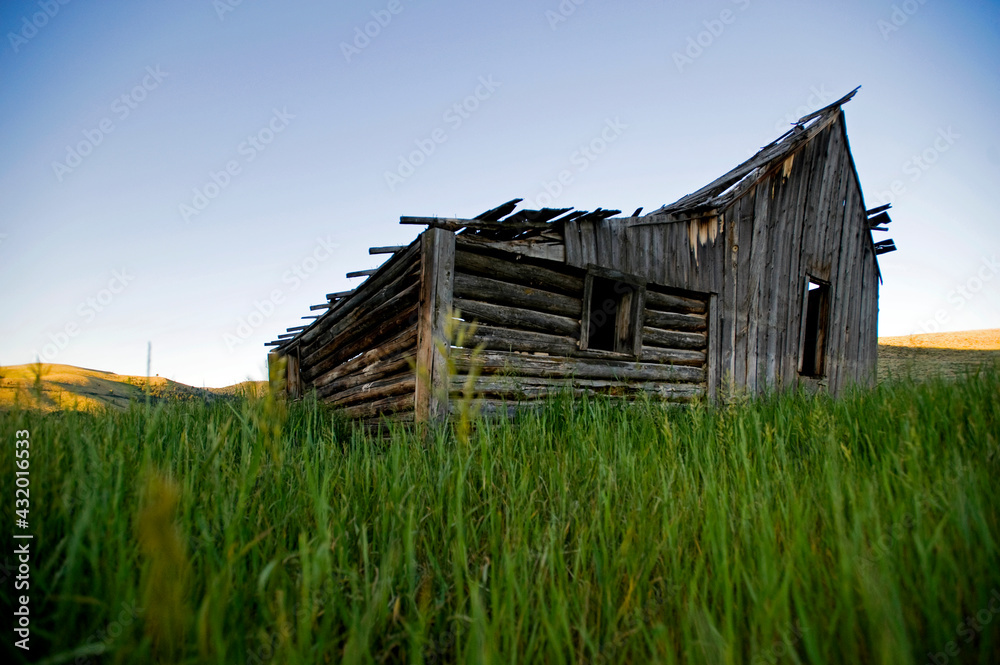 An old cabin falling down in the Tobacco Root Mountains near Pony Montana.