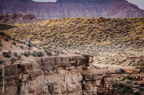 Mountain Bikers ride the popular single track: Jem Trail. Located just outside the town of Virgin near Zion National Park.