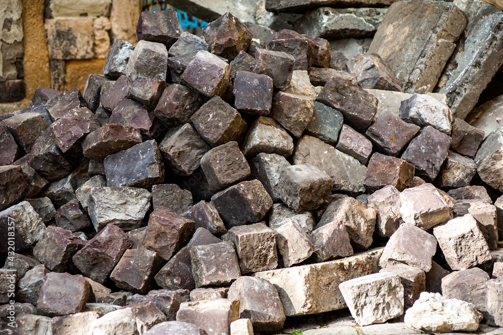 Fototapeta premium Many old cobblestones from the road are stacked