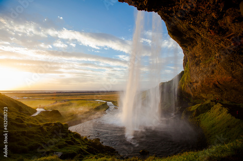 Seljalandsfoss, a waterfall fed by ice melt from the Eyjafjallajokull Glacier, in Southern Iceland, near the town of Hvolsvollur. photo