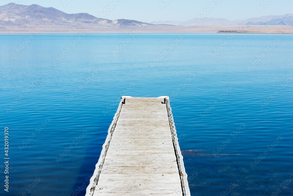 A wooden pier reaches out into Pyramid Lake, Great Basin in the northwestern part of Nevada, USA A wooden pier reaches out into Pyramid Lake, Great Basin in the northwestern part of Nevada, USA