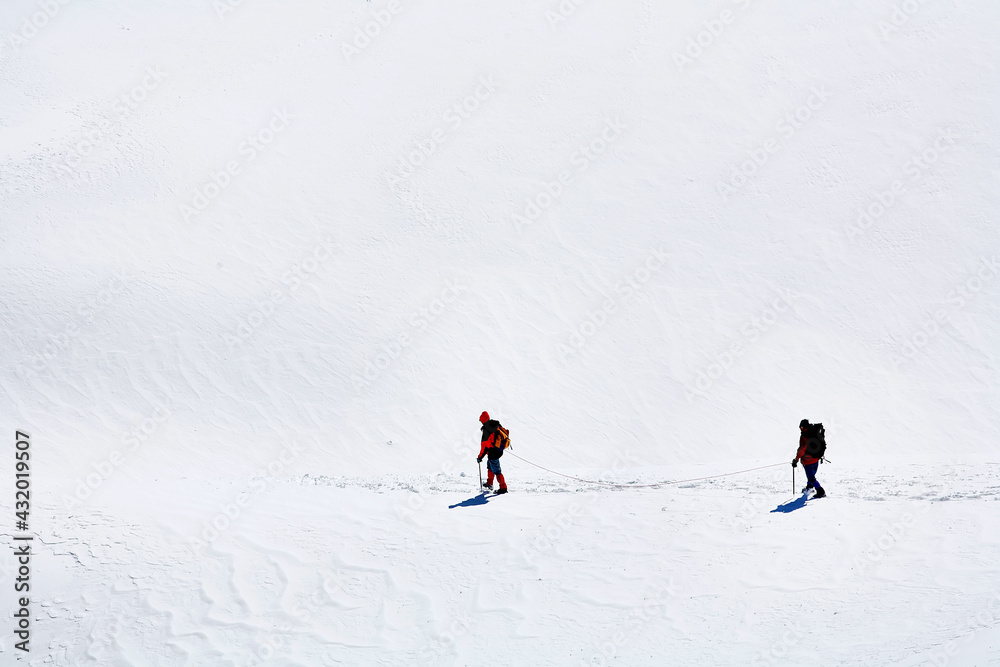 Team of climbing alpinists in Haute Savoie, France, Europe Team of climbing alpinists in Haute Savoie, France, Europe