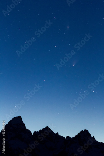 Comet Pan-STARRS streaks above the Grand Teton, Mount Owen, and Teewinot of the Teton Mountains. photo