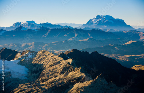 The view from three quarters of the way up Mt. Huayna Potosi as the morning begins to light the valleys behind the Cordillera Real, Bolivia. photo