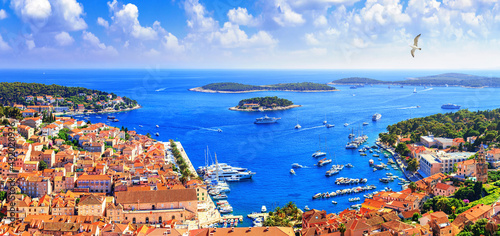 Coastal summer landscape, panorama - top view of the town of Hvar and the City Harbour with marina, on the island of Hvar, the Adriatic coast of Croatia